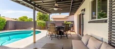 Patio, pool, ceiling fan, BBQ grill and dining table with fire pit. Large private backyard. **Pool h