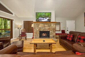 Upstairs main living room. Open floor plan with kitchen and dining rooms.