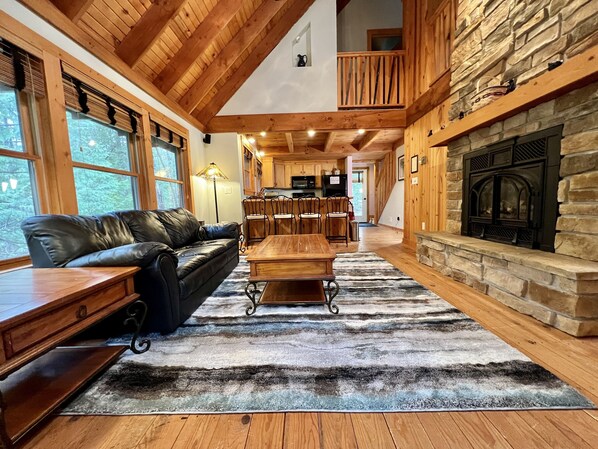 View of open concept kitchen & living areas. Lofted second floor.