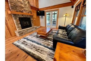 Living space with French doors that walk out to screen porch