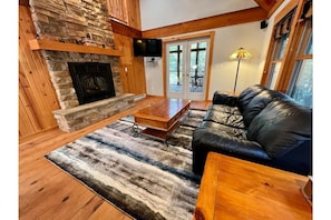 Living space with French doors that walk out to screen porch