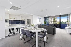 The elegant dining area is right next to the living area and the kitchen