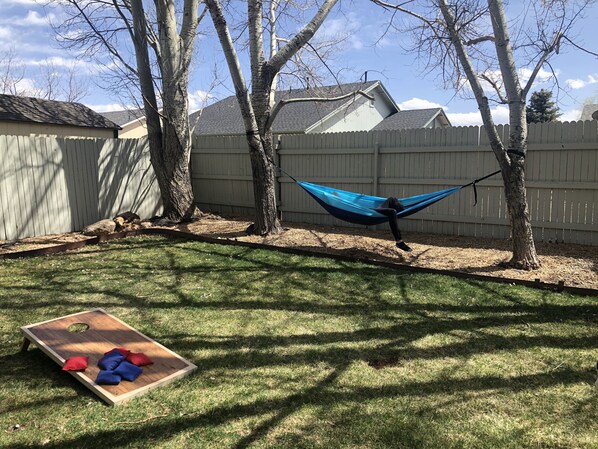 Throw some bags and relax in the backyard.