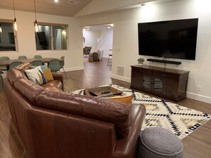 Giant family room with 75in smart TV.