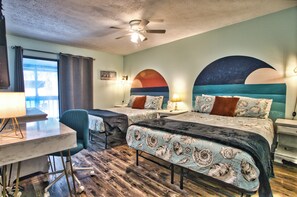 Our second bedroom has 2 queens, a TV, a dresser and a game room walk-in closet!