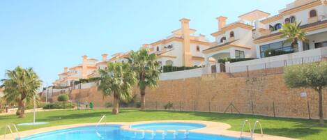 Water, Plant, Building, Sky, Blue, Tree, Swimming Pool, Grass, Residential Area, Arecales