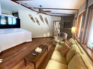 Den features Large TV, black out blinds, pull out bed and access to back yard