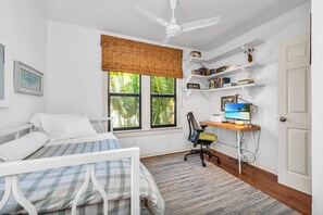 The 3rd Bedroom has a Trundle bed (sleeps 2), desk, chair, and computer monitor.