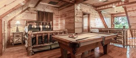 Our second floor loft area boasts a full bed, full bath and a relaxation area to enjoy a game of pool