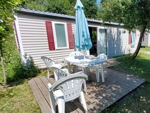 Plant, Furniture, Window, Tree, Table, Shade, Outdoor Furniture, Building, Grass, Chair