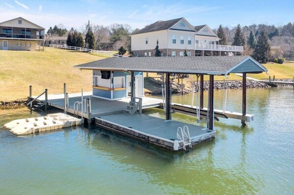 Surfside's Large dock with a bar and boathouse with refrigerator