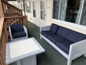 Front porch seating area to relax, listen to the ocean and enjoy a morning cup of coffee.