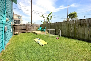 Grill, table/chairs, soccer set, cornhole set, football, volleyball set.