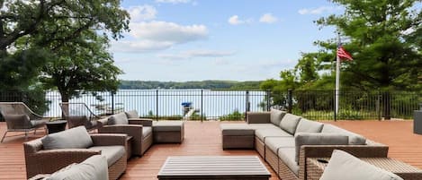 Large outdoor deck seating area with great view of lake