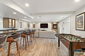 Basement living room, bar, & fooseball table