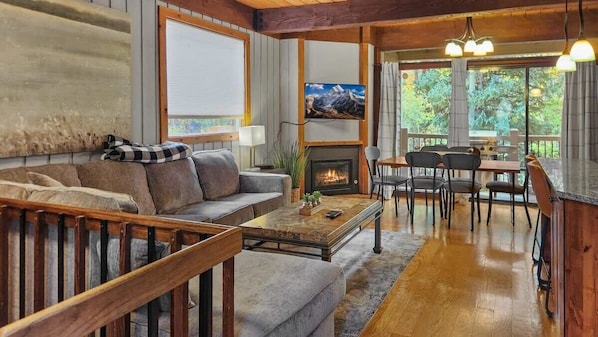 Living room: Smart TV with cable, gas fireplace, electric baseboard heat, no A/C
