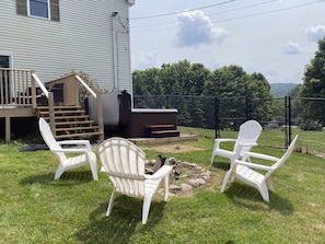 View of the Hot Tub, Lawn Chairs, and fire pit