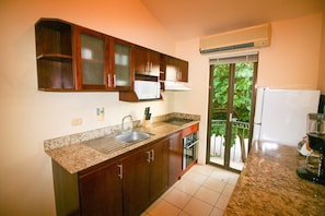The galley kitchen has a Juliet balcony for additional light. Cook dinner in or reheat your leftovers from one of the many great area restaurants.