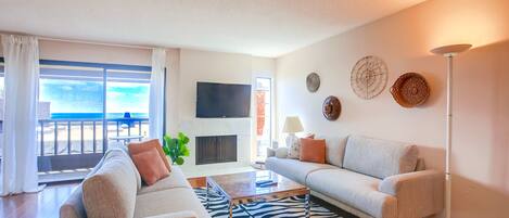 Bright & spacious living room with a Smart TV.