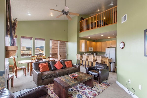 Large, well-lit open great room, dining room, kitchen and loft