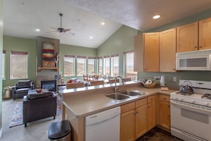 Well stocked kitchen that opens to great room for cooking and entertaining