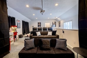 Home Theater with 10ft screen and 3 rows of seating. The Sonos Surround Sound makes this an incredible experience