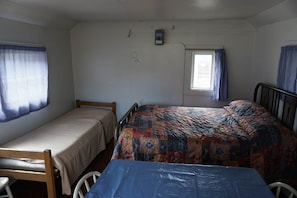 Cabin 1 includes a full bed and a twin bed.