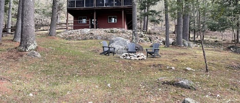 House in the woods with firepit and fully enclosed dog yard