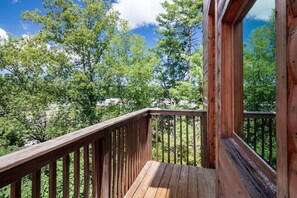 The walkway to the cabin entryway is wrapped with nature!