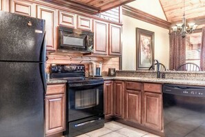 Our kitchen has modern appliances with a big fridge, freezer, oven, range top, microwave, dishwasher, toaster and coffee machine!