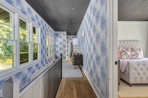 Four spacious bedrooms on street level off this hall. 3 kings and bunk room. 