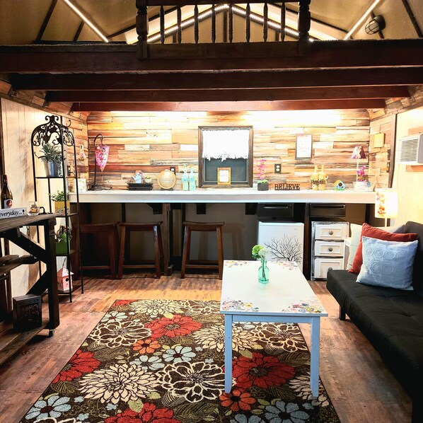 The She Shed, in the backyard, with Futon, Queen in loft, eating and coffee bar
