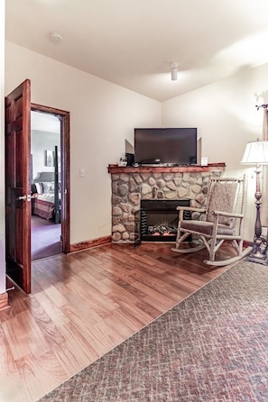 Relax in cozy rocking chair by the fire, perfect for a quick nap or just unwind