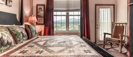 Our spacious master suite with views of the Great Smoky Mountains as the perfect backdrop.  Want to check them out even closer?  Take a walk out to the deck or hop in the car and go just a few miles up the road!