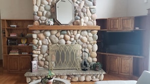 Gorgeous stone fireplace to enjoy on a chilly night.  Wood provided.