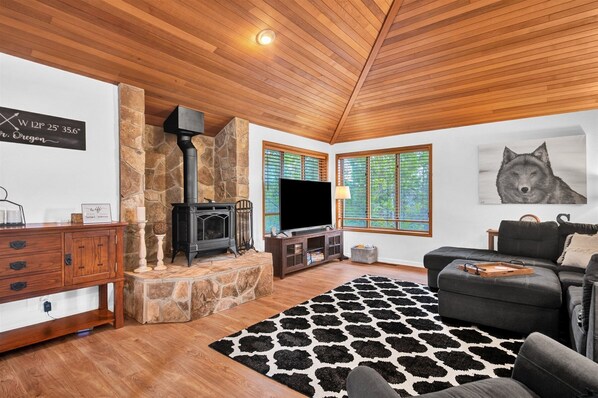 Open Living area with Gas Stove and Large Smart TV