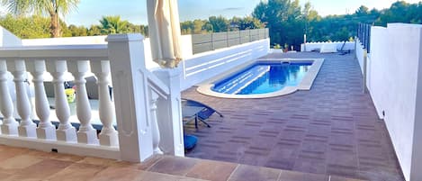 Upper and lower pool area, Loungers, and 8x seated table. 