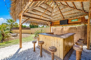 Take a break under the shaded palapa and dig your toes in the sand.