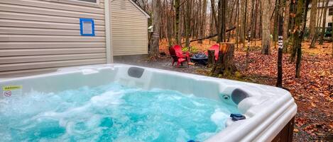 Outdoor hot tub in backyard