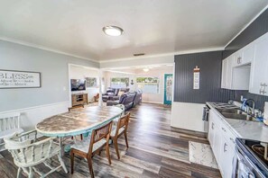 The kitchen and living room are adjacent from each other and provide a natural gathering area when you are not outside.