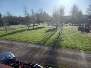 View from decking across grassed area in front of lodge