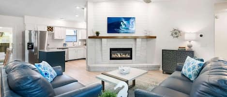 Living room with electric fireplace and Smart Tv