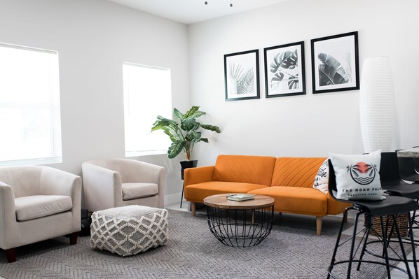 Ample seating, natural light, 55 inch t.v. and sofa that unfolds to a bed.