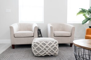 Comfy sitting area with floor ottoman