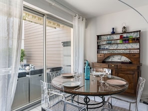 Water, Table, Tableware, Property, Sky, Furniture, Building, Window, Blue, Chair