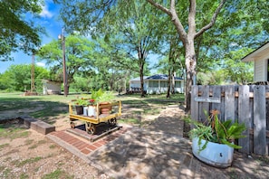 The Guest House is nestled in the middle of 30+ wooded acres.