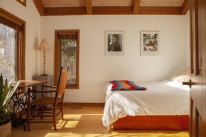 Queen Bedroom (queen bed and a trundle, workspace, bookshelves, skylights.)