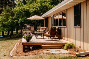 Lakeside deck with plenty of seating to enjoy the panoramic lake view
