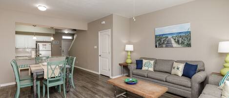 Spacious living, dining and kitchen area with lovely decor and cozy seating