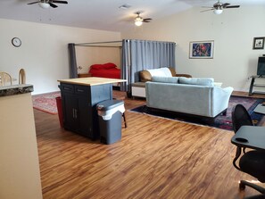 The view of the bedroom and living room as you enter.
